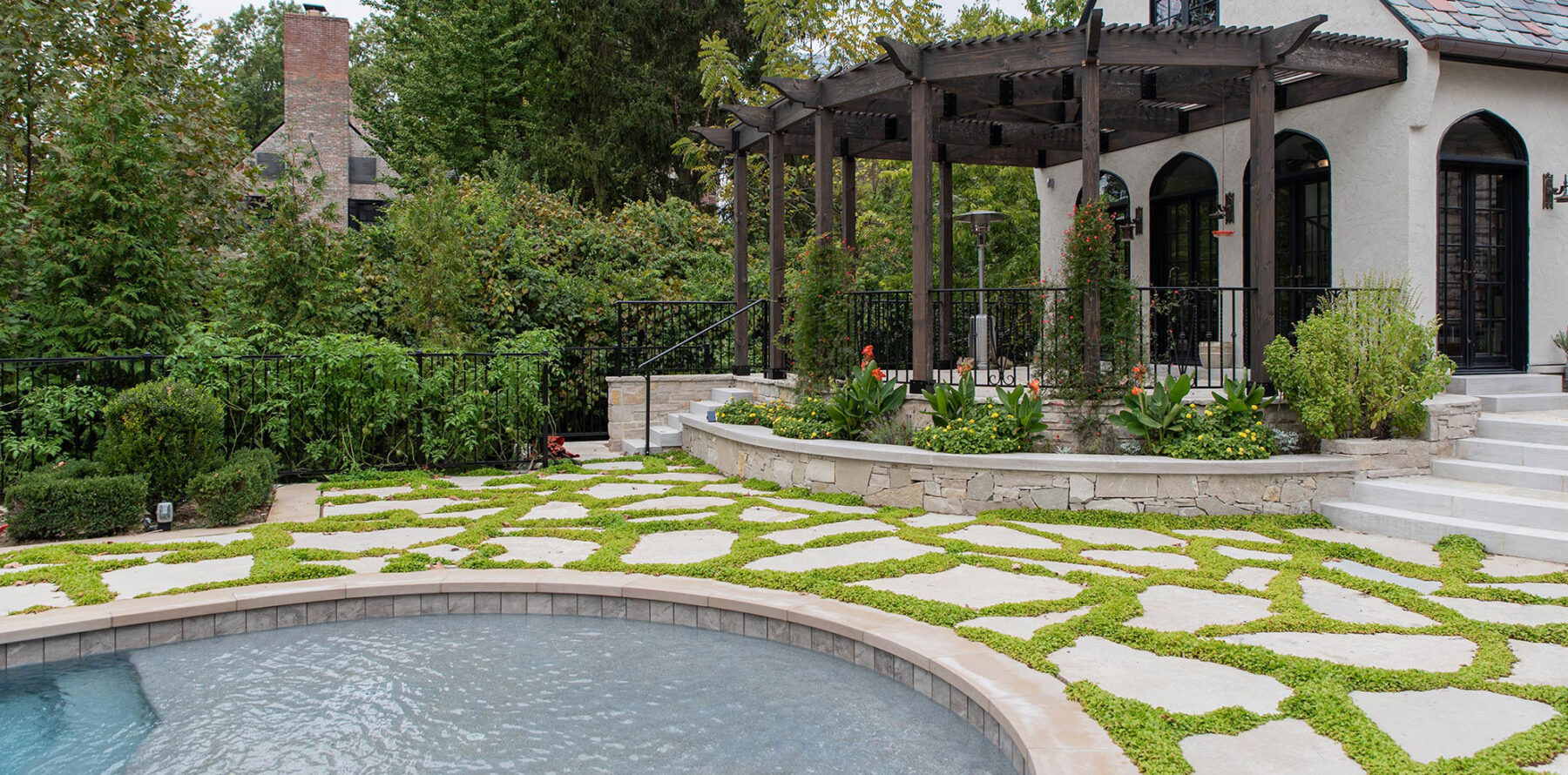 Back yard pond landscaped with large Rademann stone