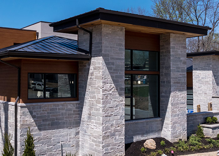 Exterior of a modern home featured Rademann Stone veneer
