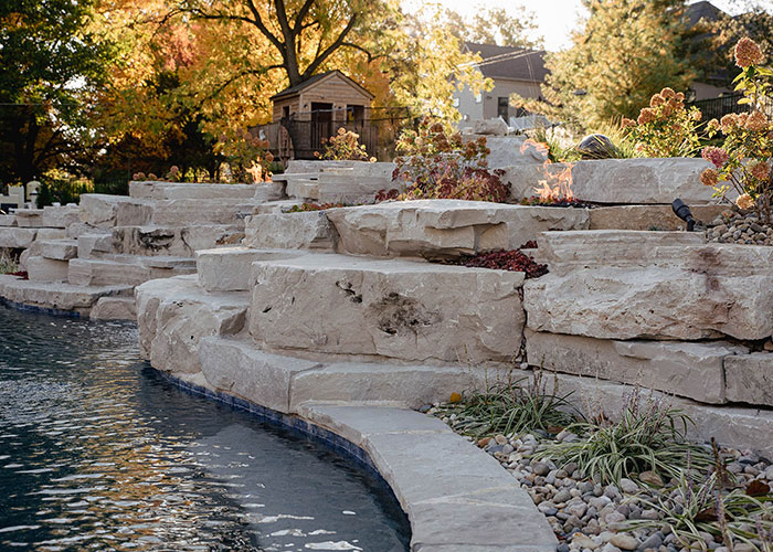 edge of a pond featuring Rademann landscape stone