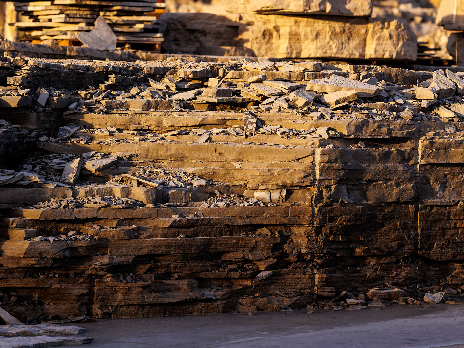 Stone wall illuminated by early morning sunlight in the Rademann Stone quarry